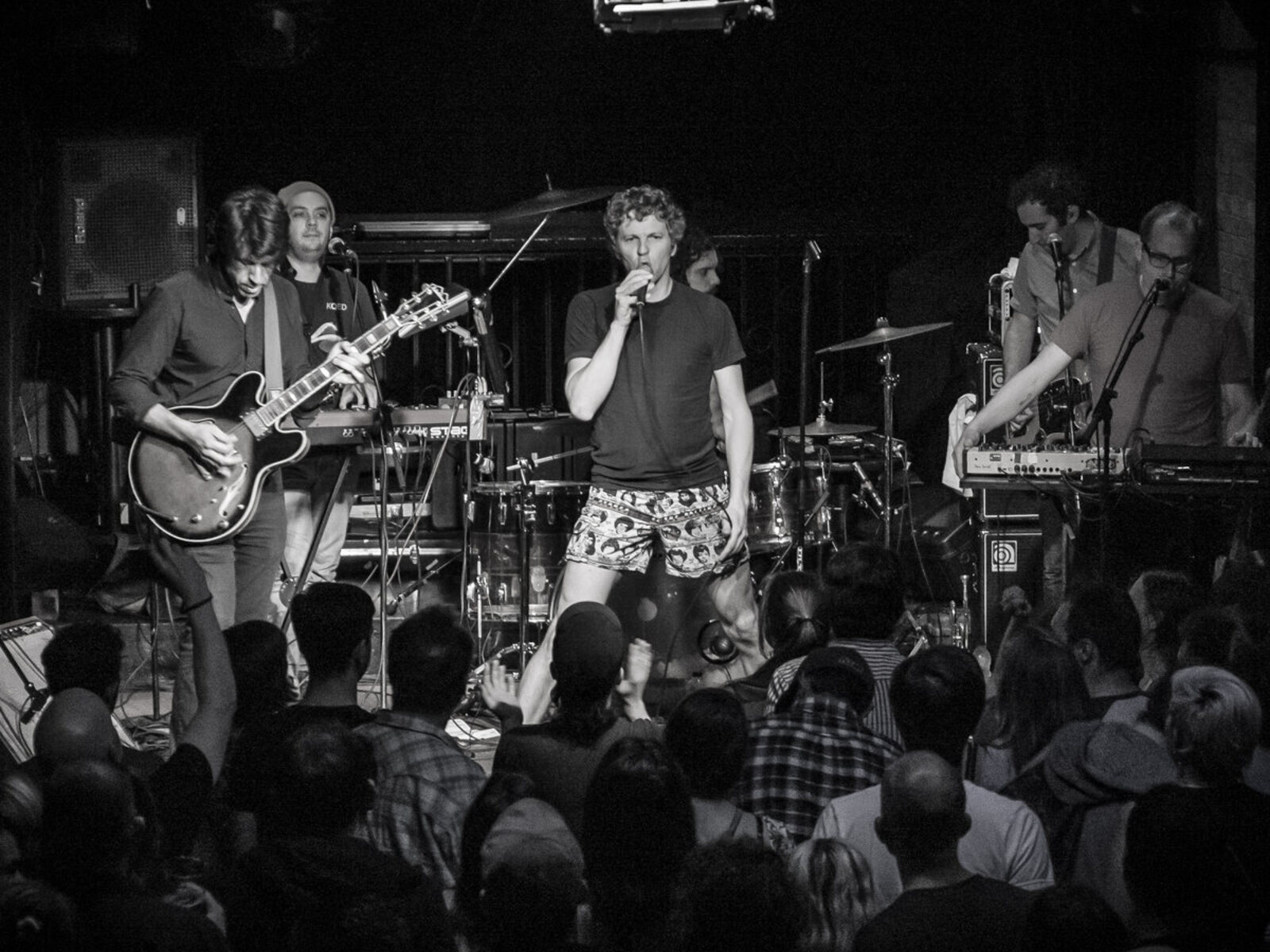 Tape Ghost crowd-side stage photo with dramatic club lighting